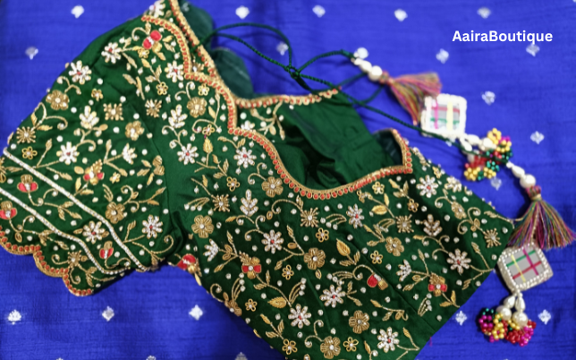 Projects 5 Dark green bridal blouse with intricate gold and silver floral embroidery and a beaded dori, showcasing a custom design for bridal wear projects.